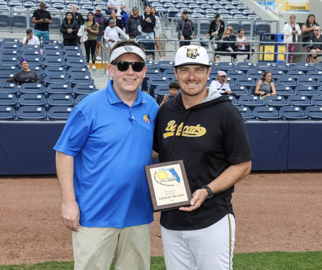 Lyndon Coleman, PHSC athletic director and head baseball coach accepts award from Rob Chaney, FCSAA associate director and athletics commissioner